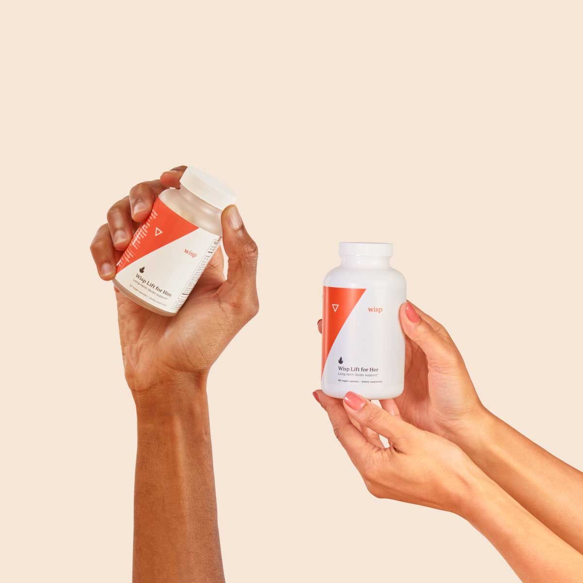 Bottles of Wisp Lift for Him and Wisp Lift for Her on a cream surface