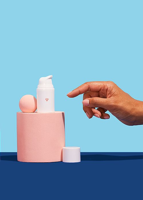 a woman's hand reaches for BV treatment on a blue background