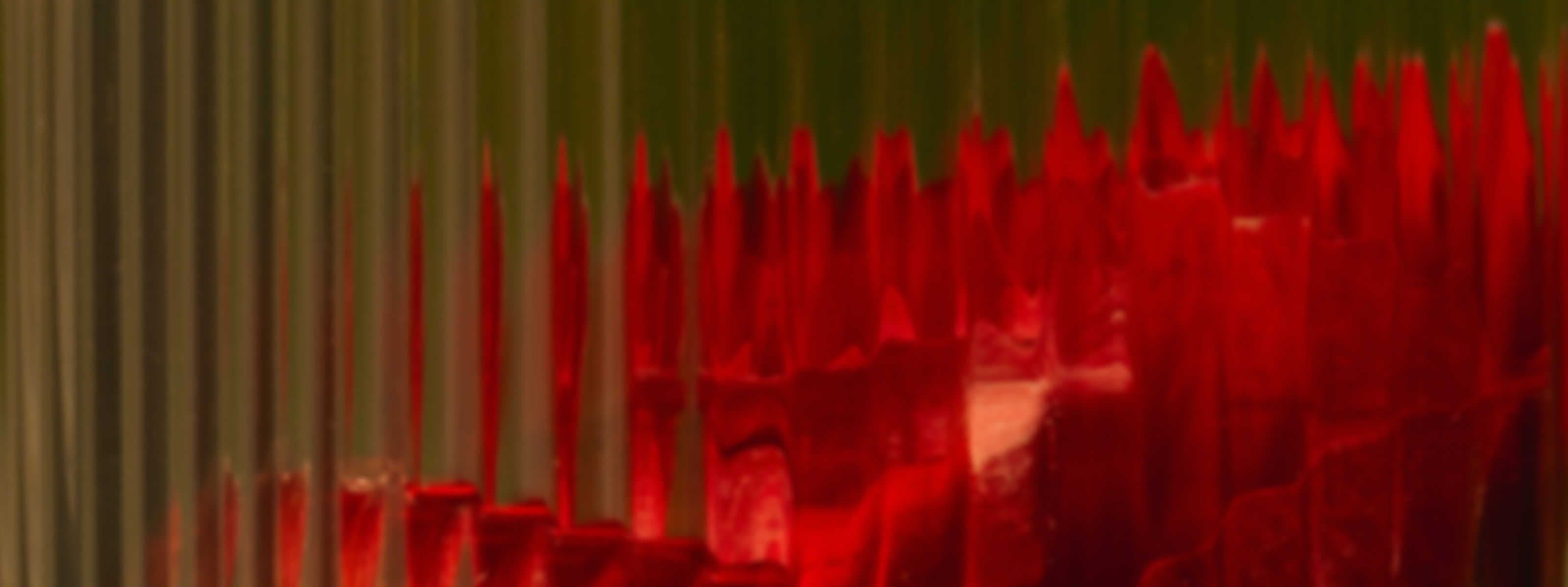 Abstract graphic of jagged red spikes rising left to right, symbolizing increasing thyroid peroxidase antibody levels.