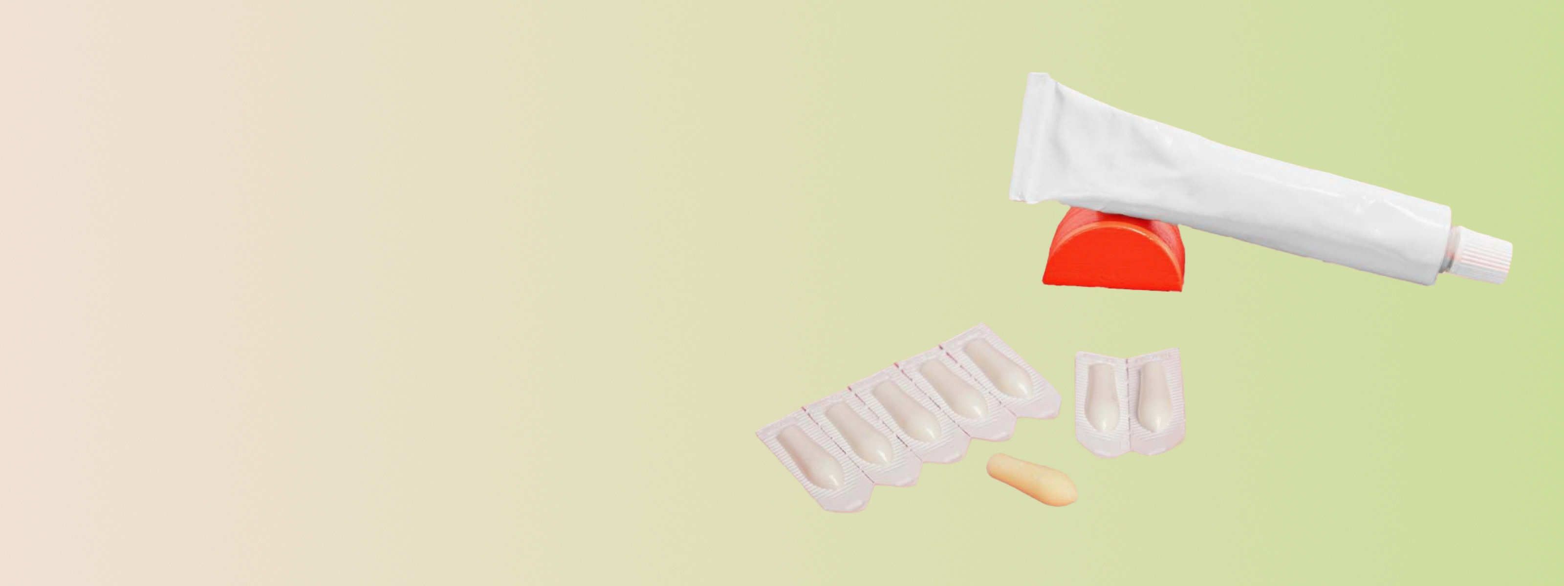 Suppositories to treat hemorrhoids on a green background