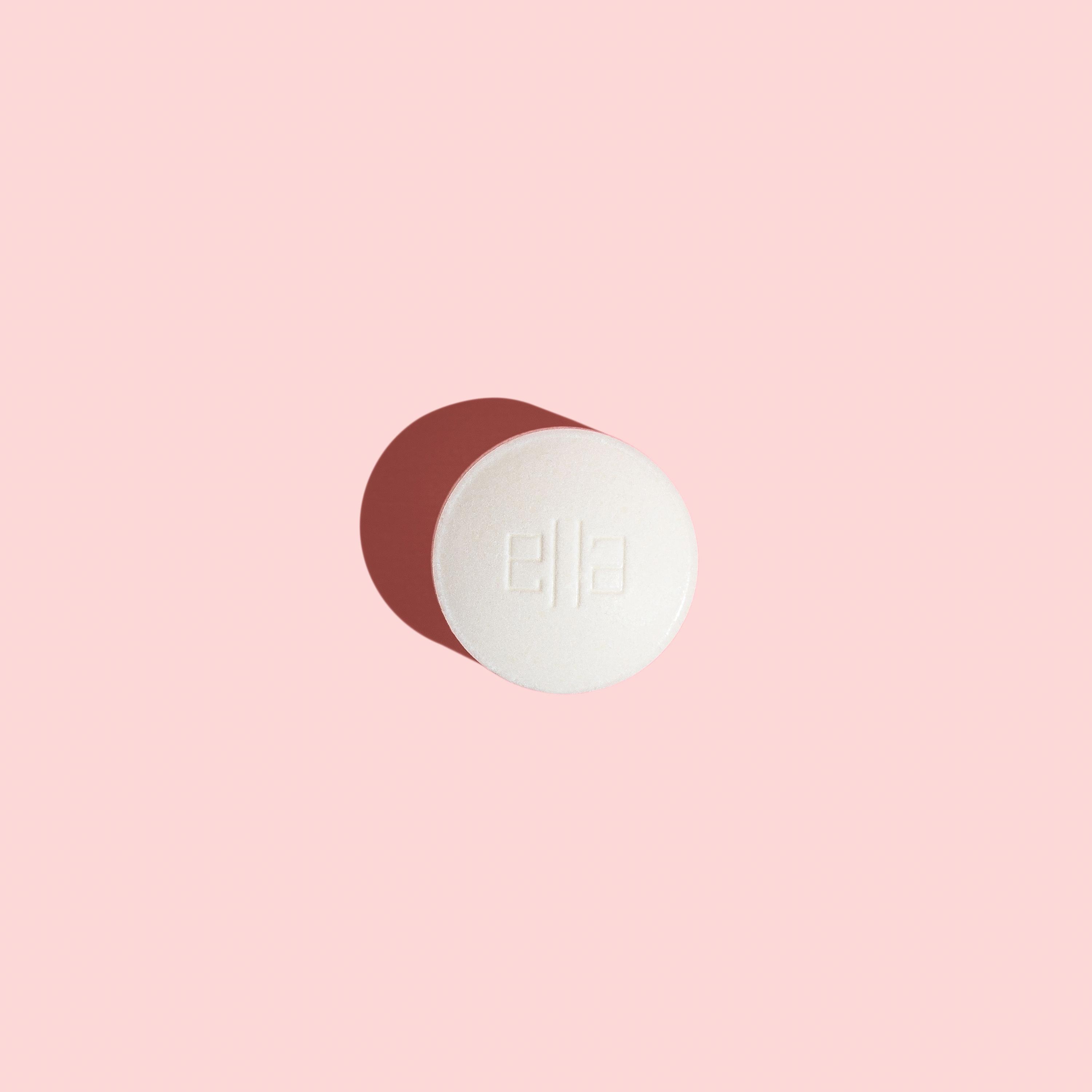 Ella emergency contraception pill to prevent pregnancy on a pink background