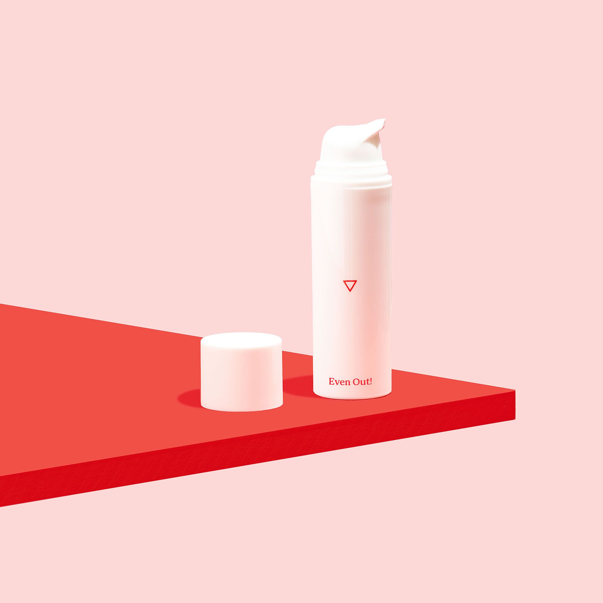 Bottle of Hydroquinone cream on red surface with pink background