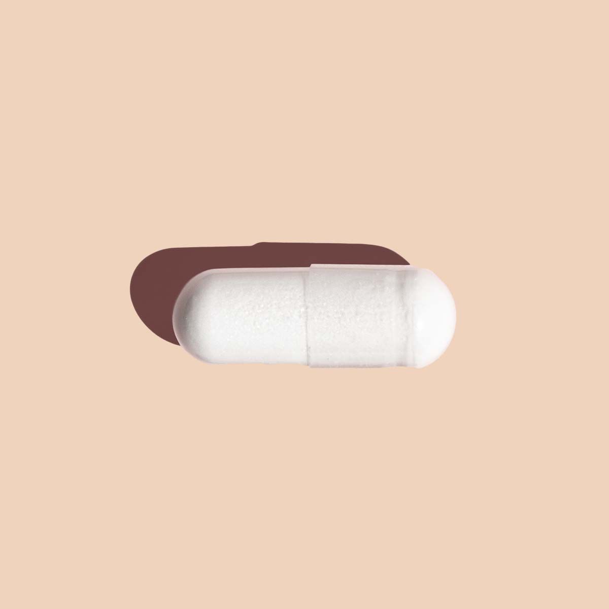 Single boric acid suppository on cream background