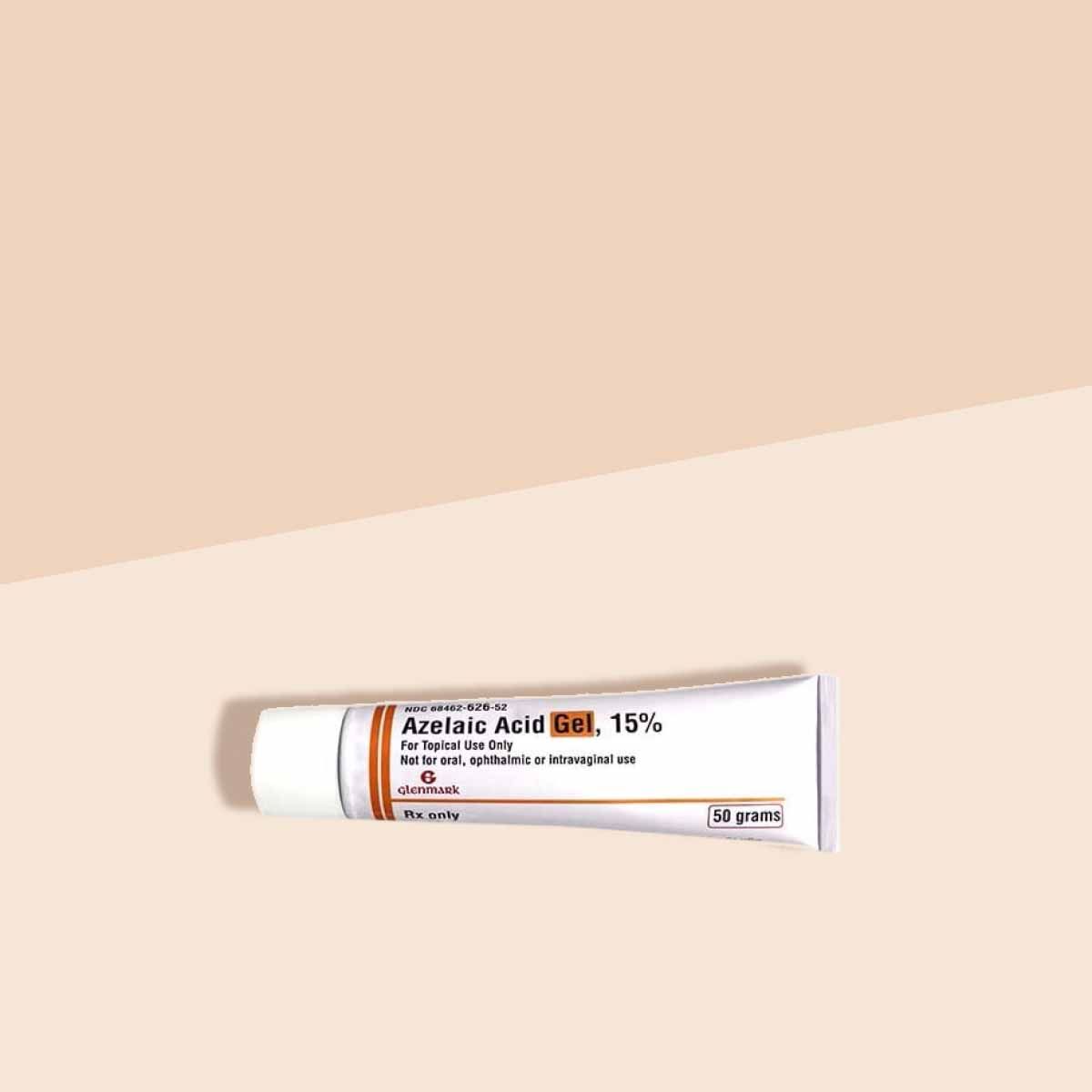 A tube of Azelaic Acid on a cream surface