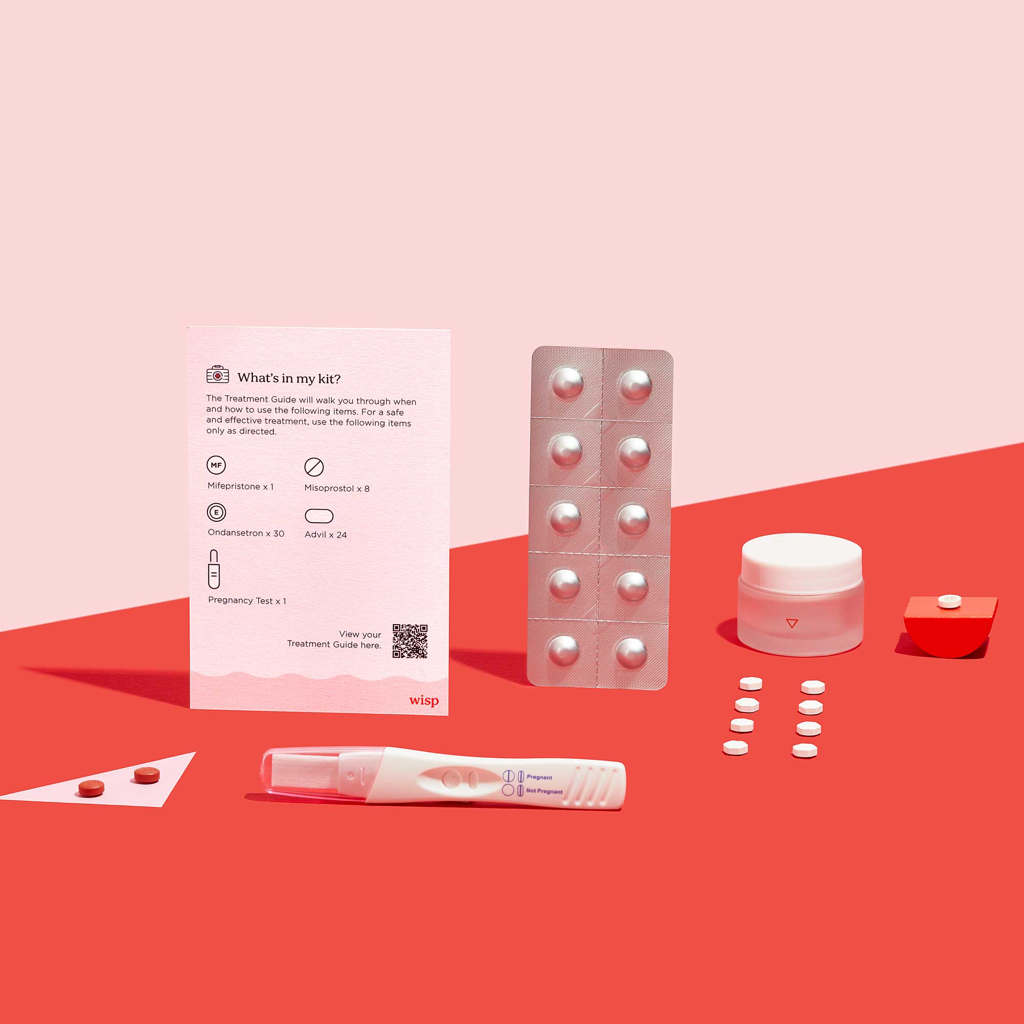 Wisp Medication Abortion kit contents on a red surface, on a pink background