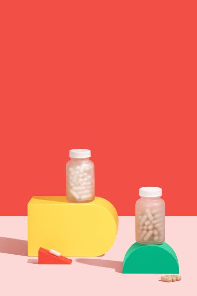 Wisp Herpes Medication with colorful abstract shapes in a red and pink background