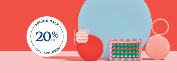 Various birth control methods balanced on colorful abstract shapes on a pink surface with a red background