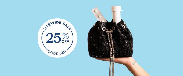 A woman's hand holding a black sparkly bag with a Wisp vial and a packet of zofran anti-nausea medication poking out of the top in front of a light blue background