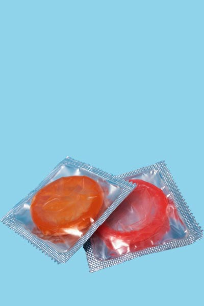 2 colorful condoms on a light blue background