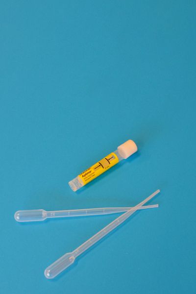 Urine test for UTI objects on a blue background