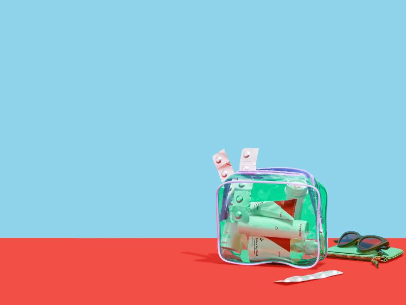Wisp medications in a green travel bag on a red and blue background
