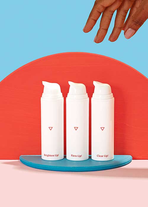 Skincare bottles displayed with colorful shapes and backgrounds