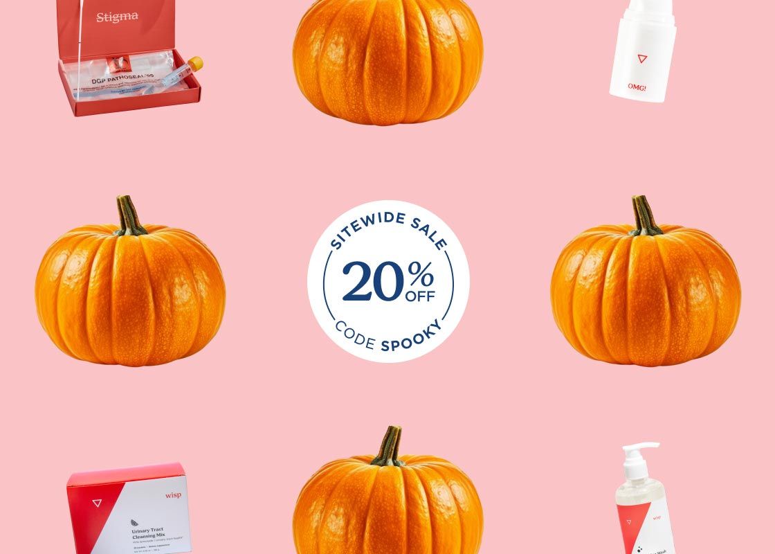 Pumpkins and various Wisp products with a pink background