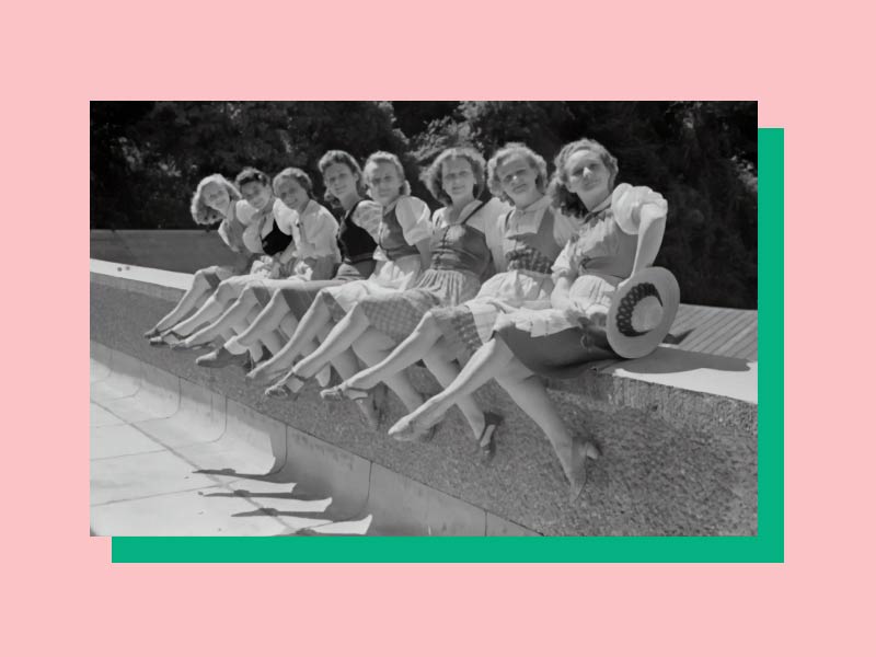 A vintage ad of 8 women sit with their legs crossed on a concrete ledge