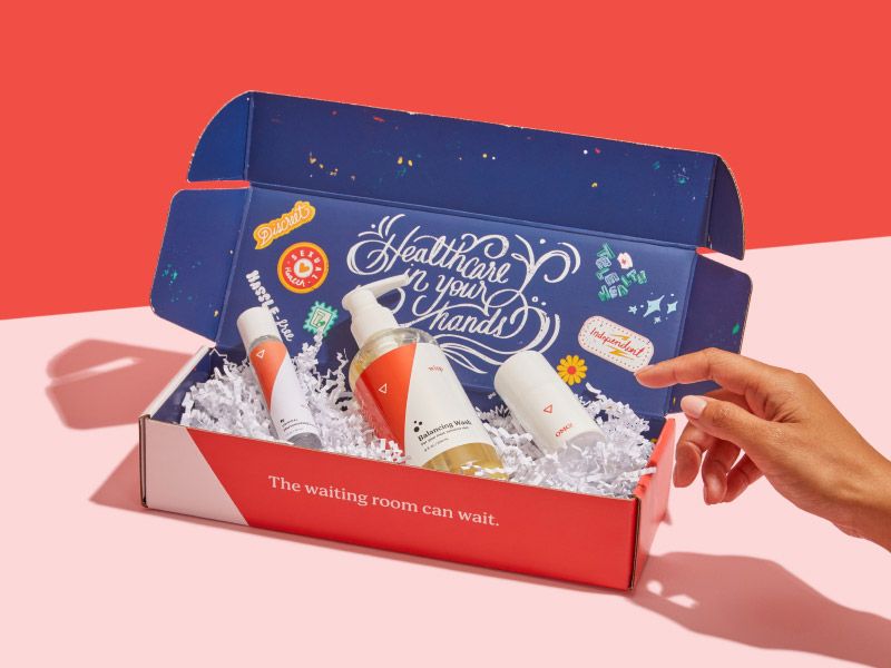 a woman's hand reaching for Wisp products inside a box featuring Rosie Le's artwork on a pink and red background