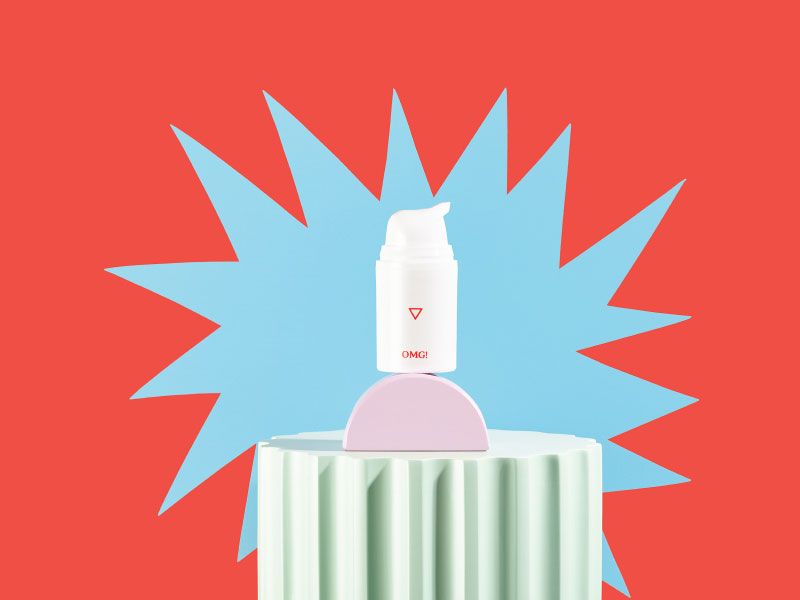 OMG! Cream on colorful abstract shapes with a light blue starburst behind it and a red background