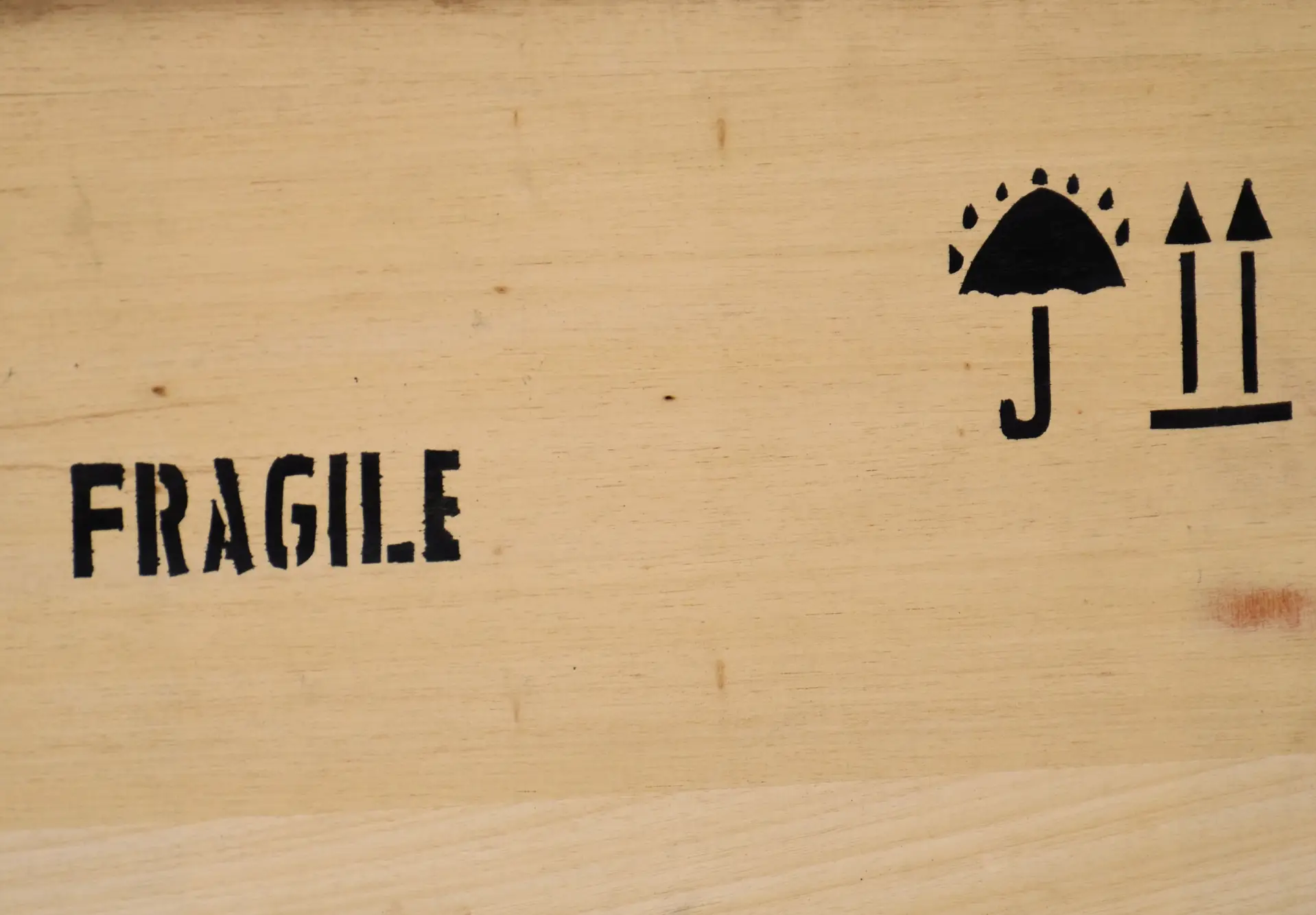 a wooden container marked fragile
