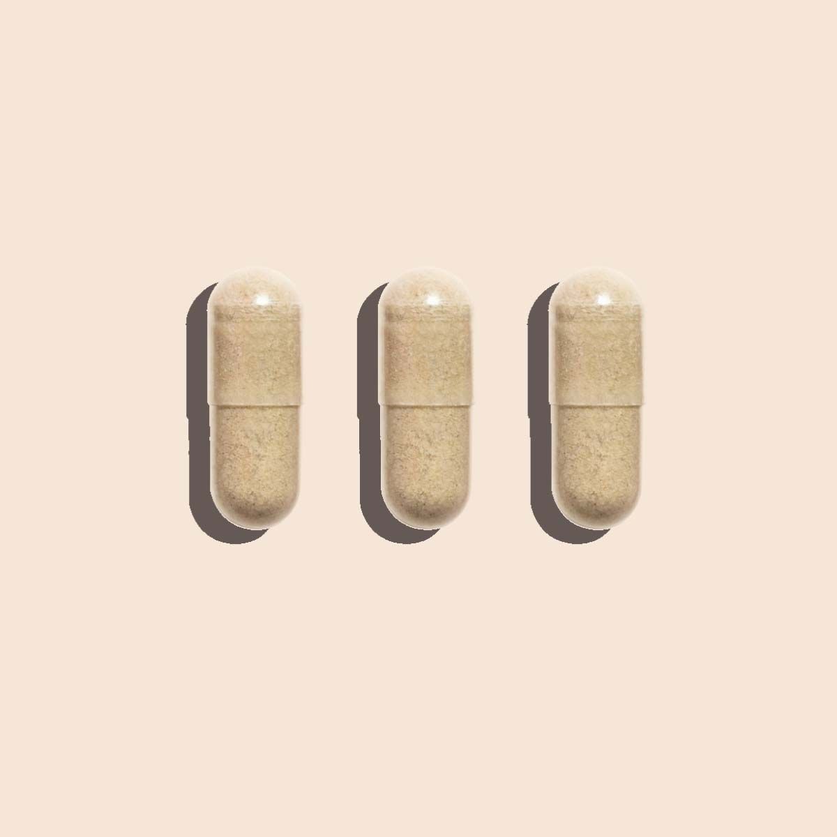 3 AV Defender pills on a cream surface