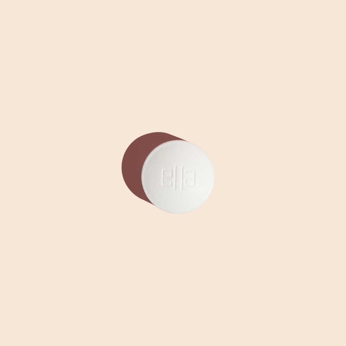 Ella emergency contraception pill to prevent pregnancy on a cream background
