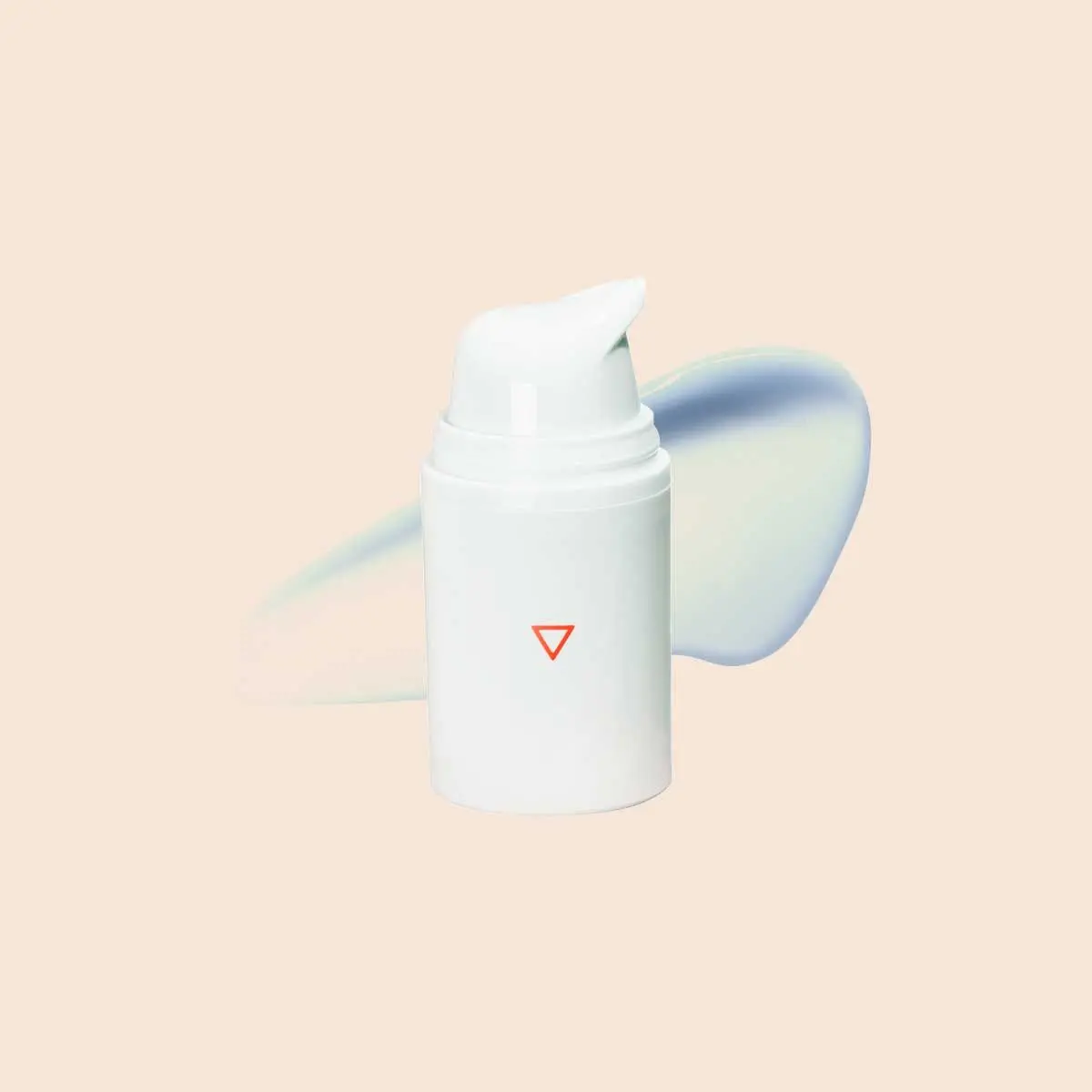A Wisp pump bottle with a cream swatch on a beige surface