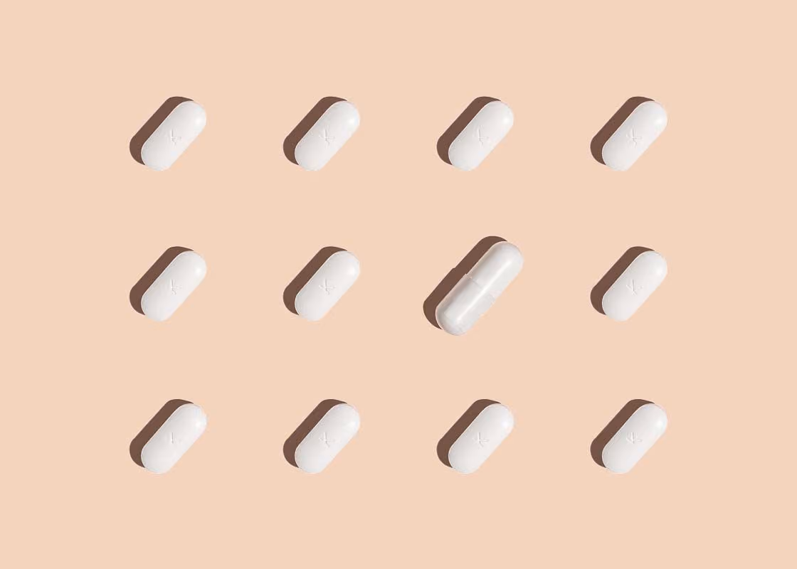 pills from Wisp to treat BV and Yeast Infections on a cream background
