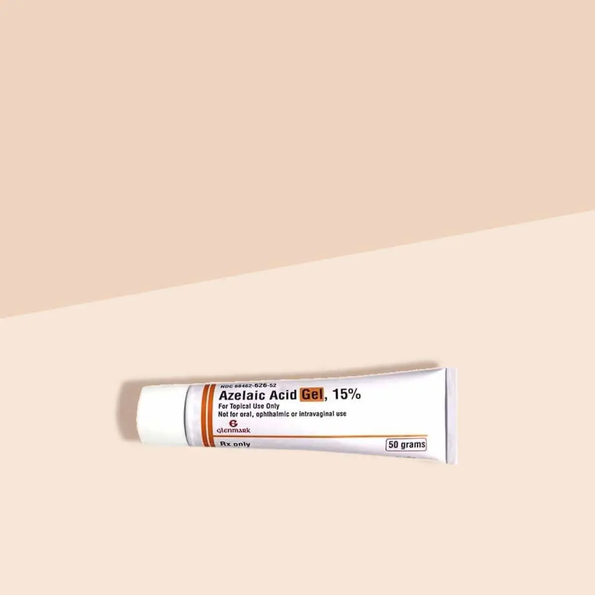 A tube of Azelaic Acid on a cream surface