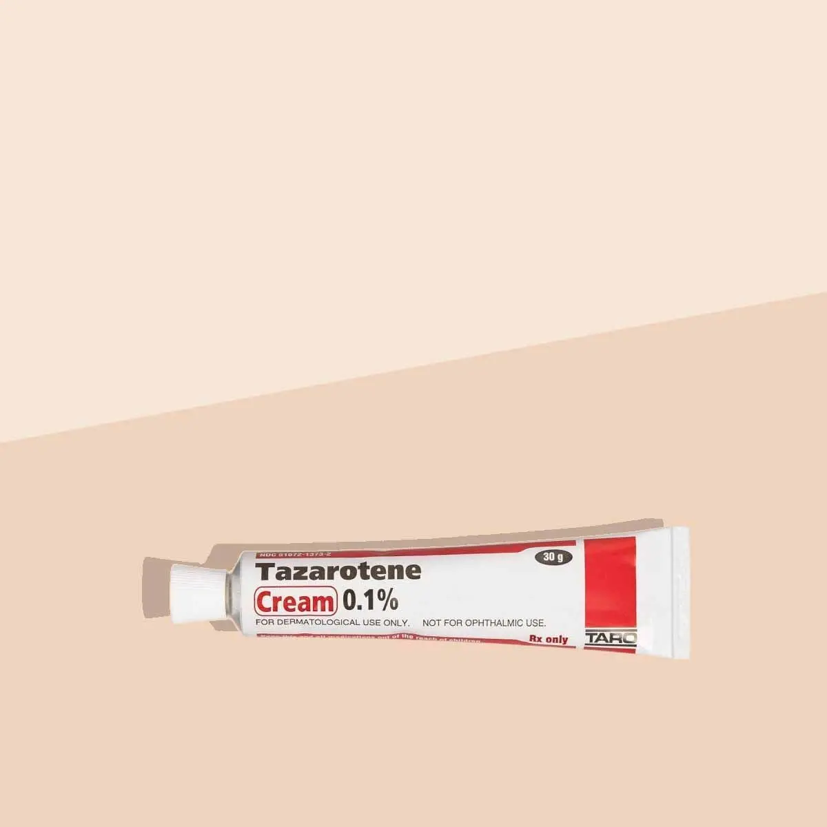 A tube of Tazarotene on a cream surface